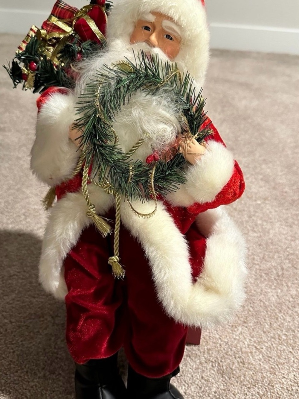 Sitting Santa Holding A
Bag Of Presents